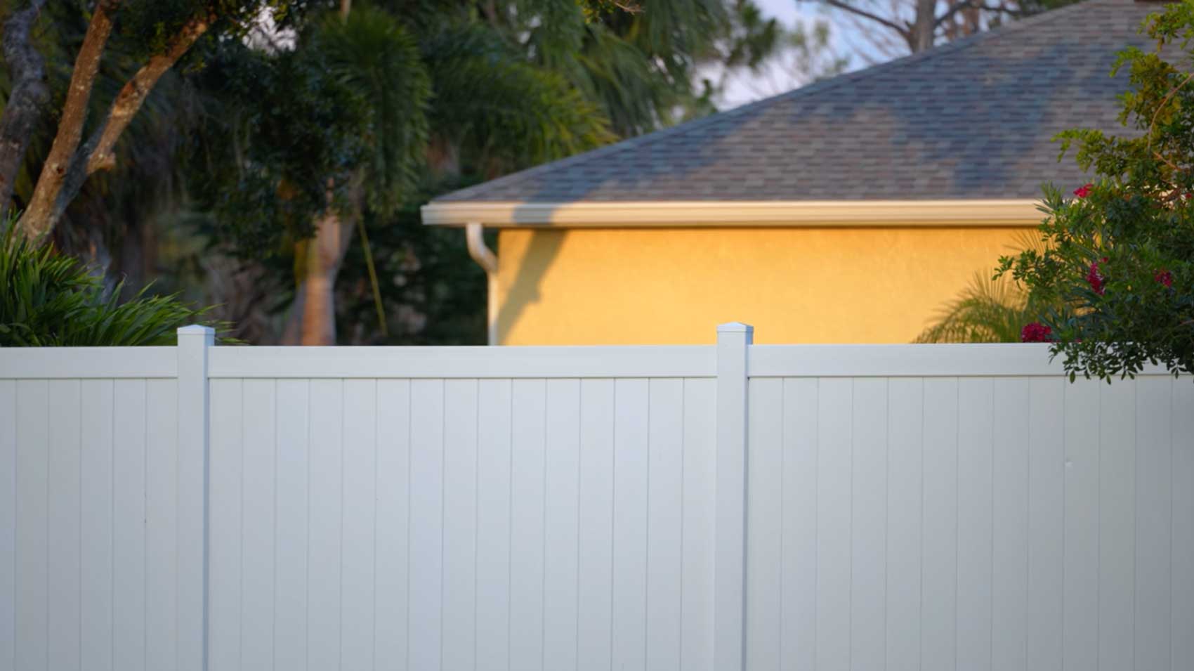 White Vinyl Fence With Palm Trees